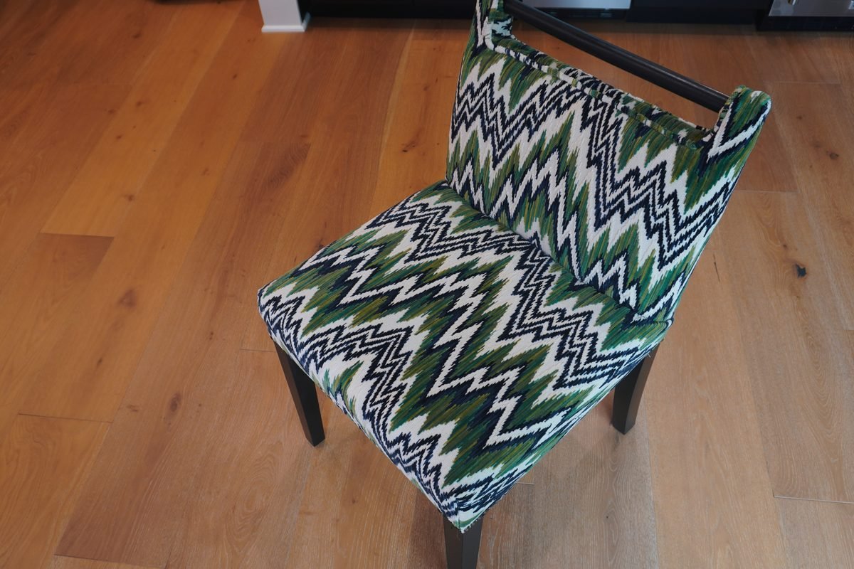 Accent chair featuring a bold, colorful ikat patterned fabric
